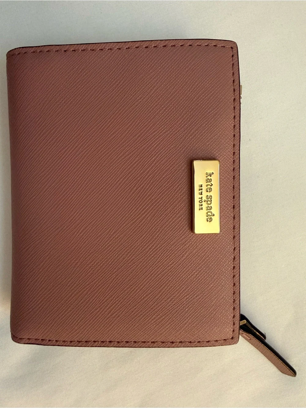 kate spade mauve pink leather zip wallet with gold plaque